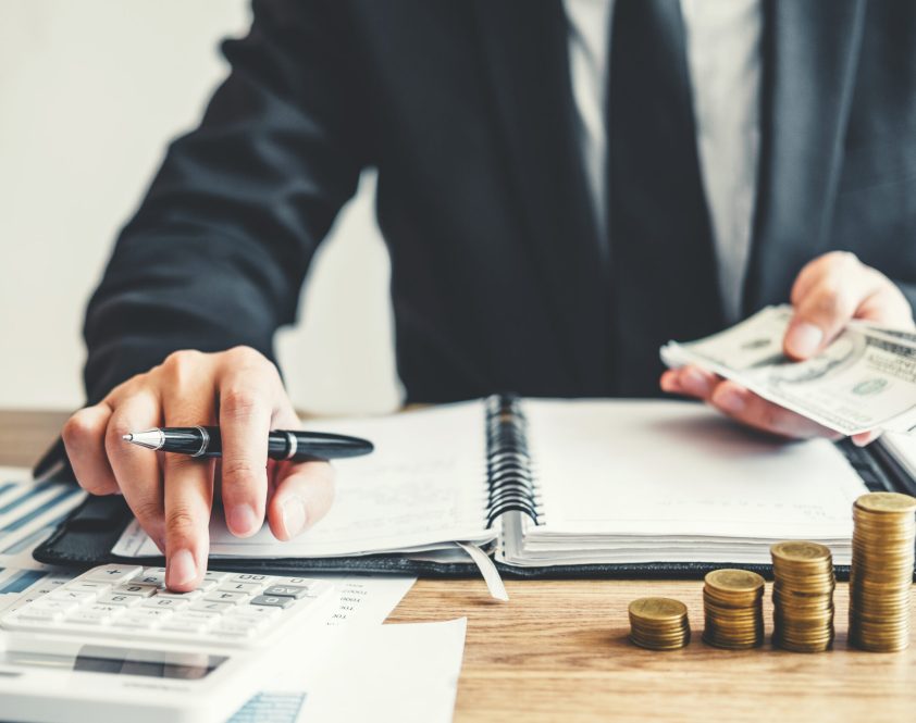 Business man Accounting Calculating Cost Economic budget investment and saving concept